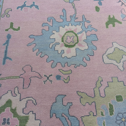 Pink Oushak Rug with Blue & Green Floral Design