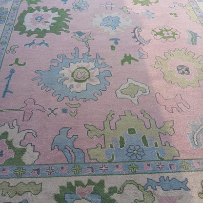 Pink Oushak Rug with Blue & Green Floral Design
