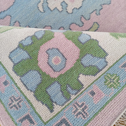 Pink Oushak Rug with Blue & Green Floral Design