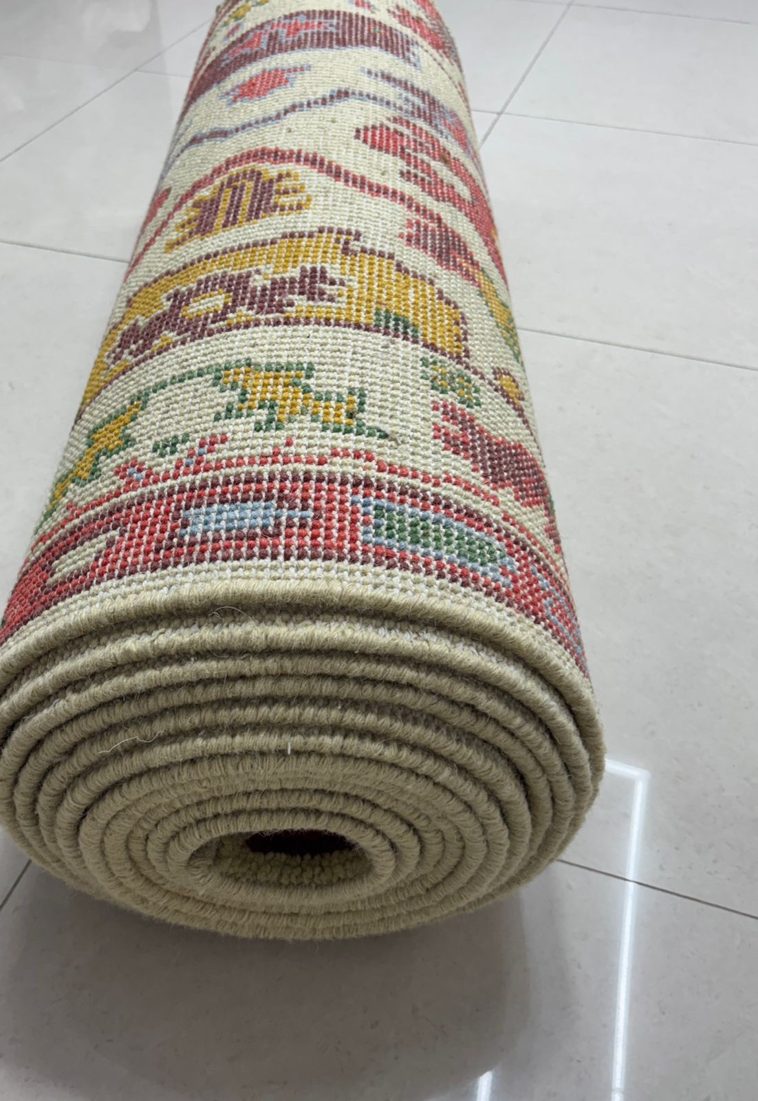 Rolled handmade Oushak runner rug ready for shipping