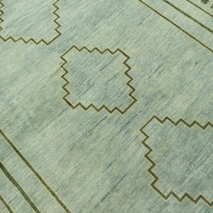 Angled view of minimalist sage green wool rug in full layout