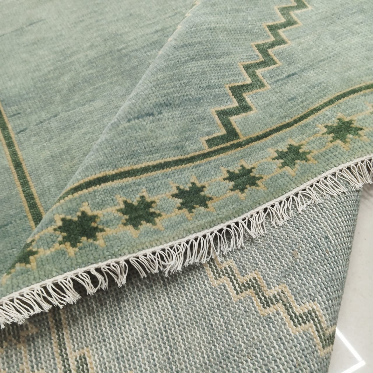 Backside view of handwoven flatweave wool rug