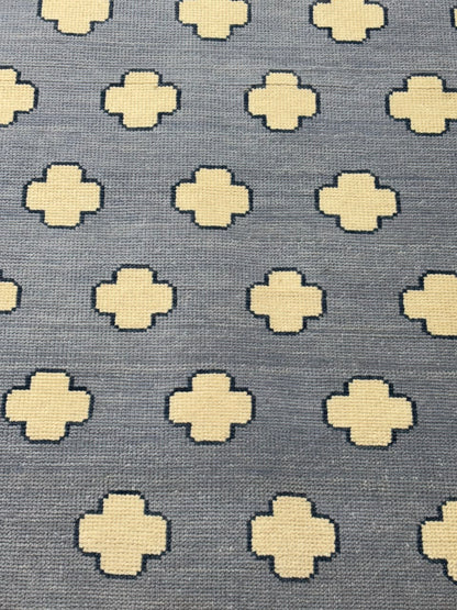 Close-up of the soft low-pile wool surface on a modern Scandinavian area rug.