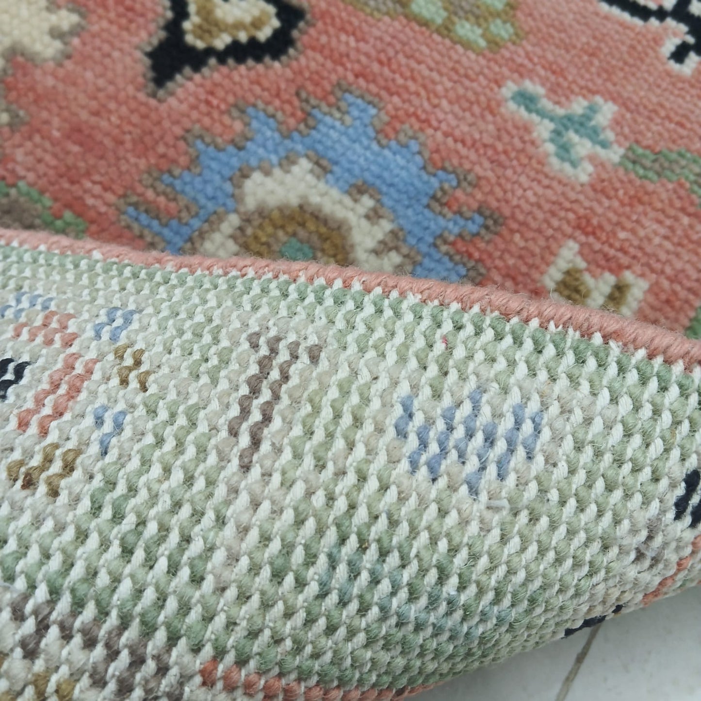 Back view of handwoven Turkish Oushak rug showing tight wool weave and craftsmanship