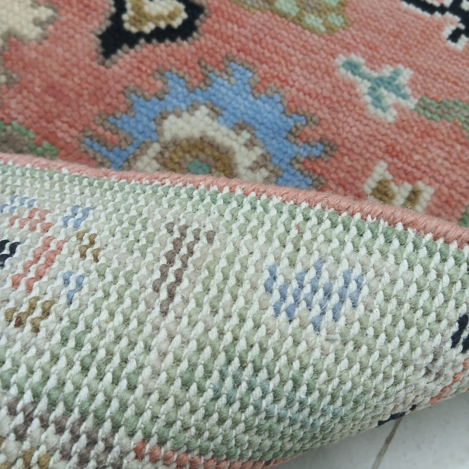 Back view of handwoven Turkish Oushak rug showing tight wool weave and craftsmanship